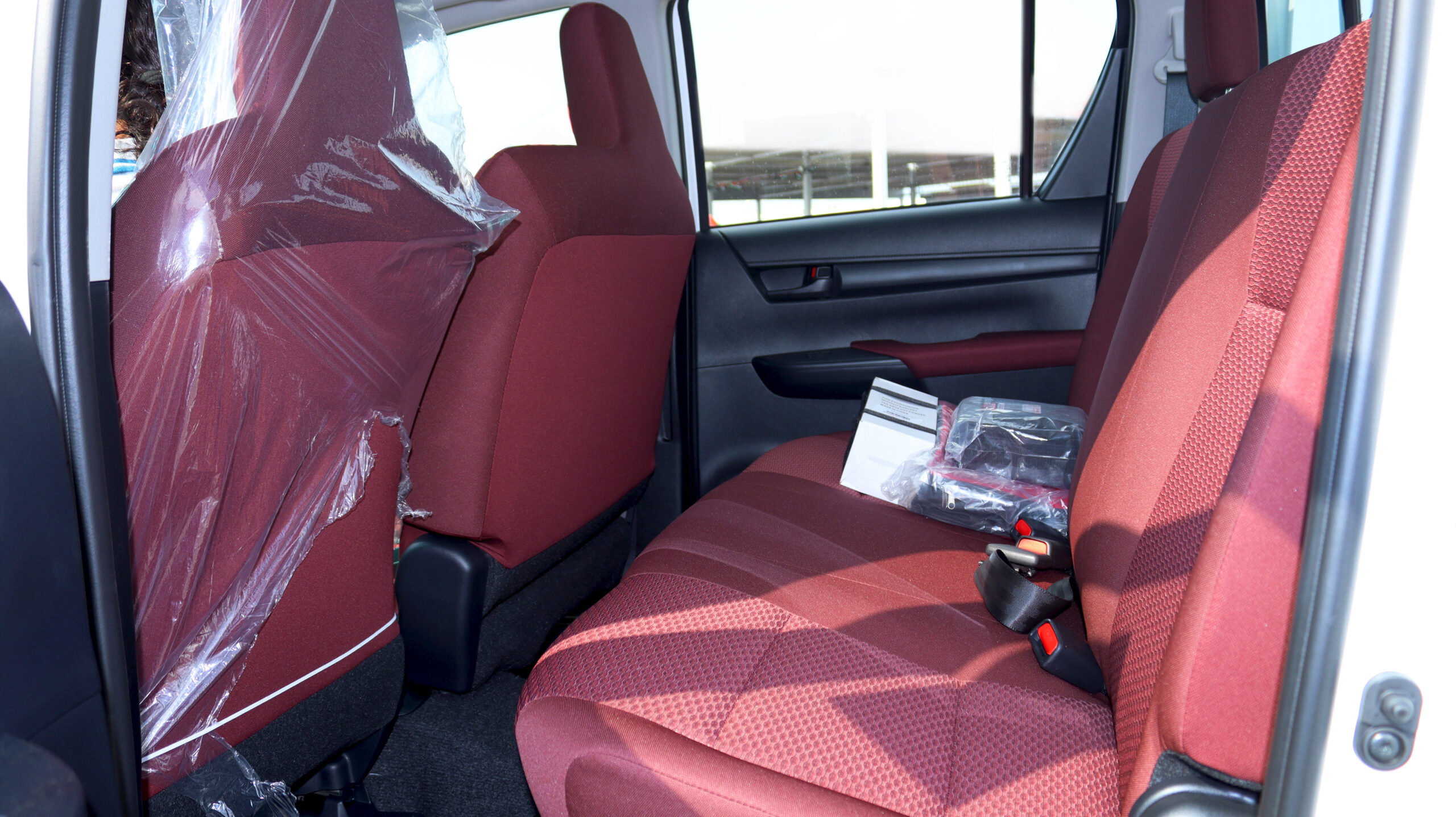 Put this Car under an Ultra Modern City Bridge in night view and shining city light