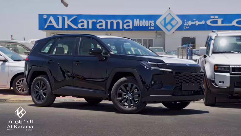 2026 Toyota RAV4 HEV side profile parked outside Al Karama Motors showroom in Dubai.