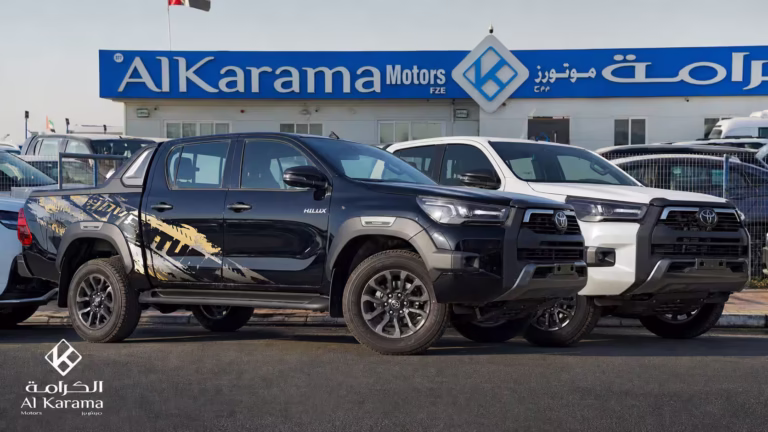 2026 Toyota Hilux Adventure Double Cab pickup in Black and White displayed outside Al Karama Motors Dubai