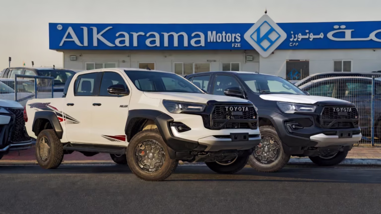 2026 Toyota Hilux GR Sport Double Cab pickup in White and Black parked outside Al Karama Motors Dubai