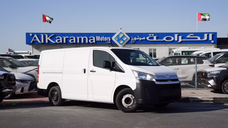 2026 Toyota Hiace Cargo Standard 3.5L Petrol Manual parked outside Al Karama Motors showroom in Dubai.