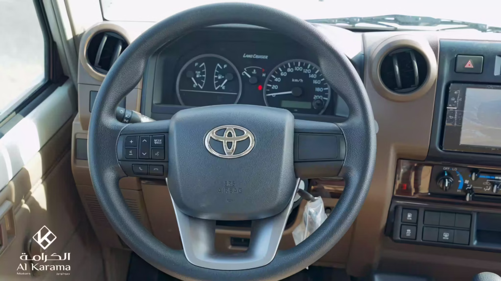Toyota LC78 steering wheel with audio and phone controls and analogue gauges