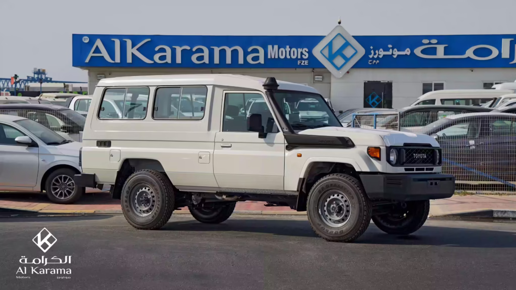 White 2026 Toyota Land Cruiser LC78 4.0L manual petrol hardtop side view at Al Karama Motors Dubai
