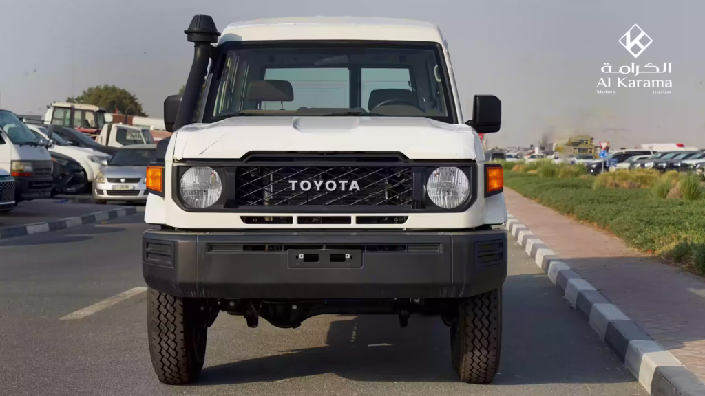 Front view of white 2026 Toyota Land Cruiser LC78 with Toyota grille and snorkel