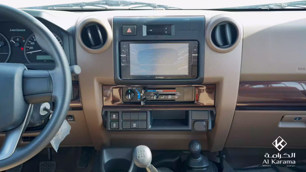 Touchscreen and manual climate controls inside 2026 Toyota Land Cruiser LC78