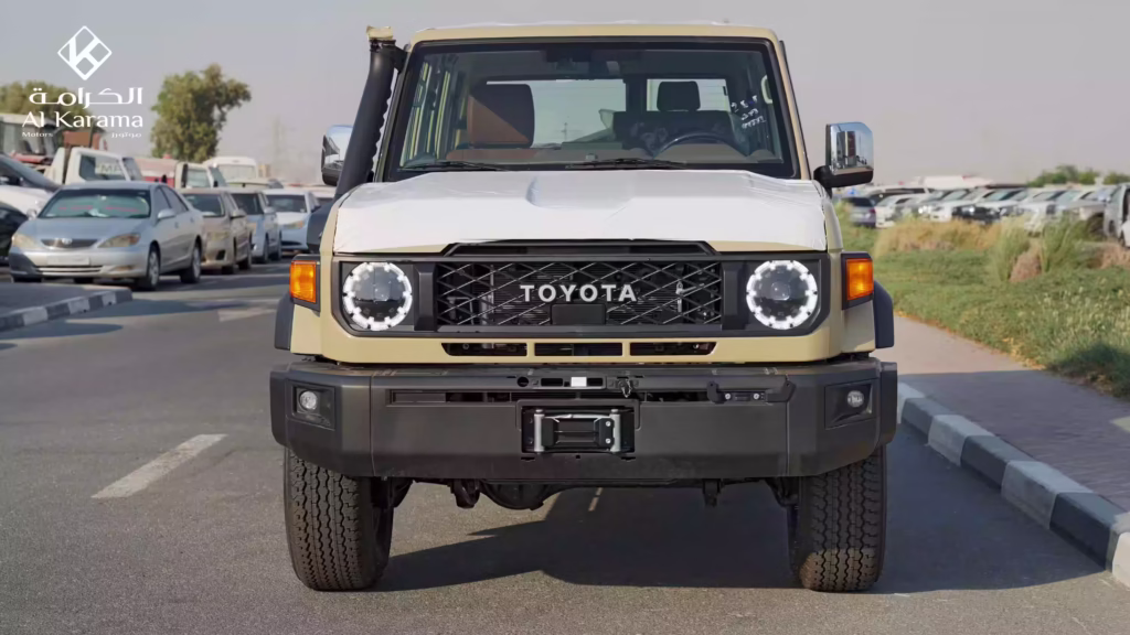 Front view of 2026 Toyota Land Cruiser LC76 2.8L Hardtop showing LED headlights, front grille, and winch bumper
