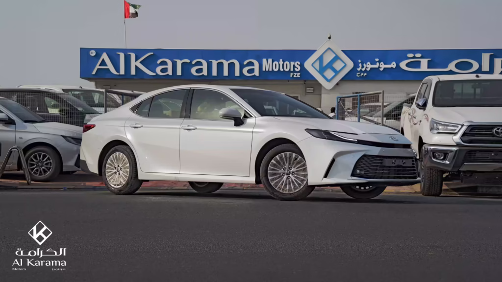 White 2026 Toyota Camry 2.5L LE Petrol side view at Al Karama Motors Dubai
